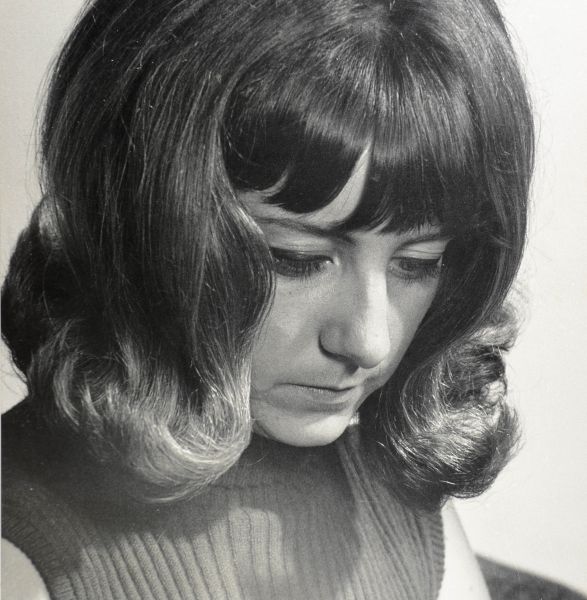 File:Woman looking downwards.jpg